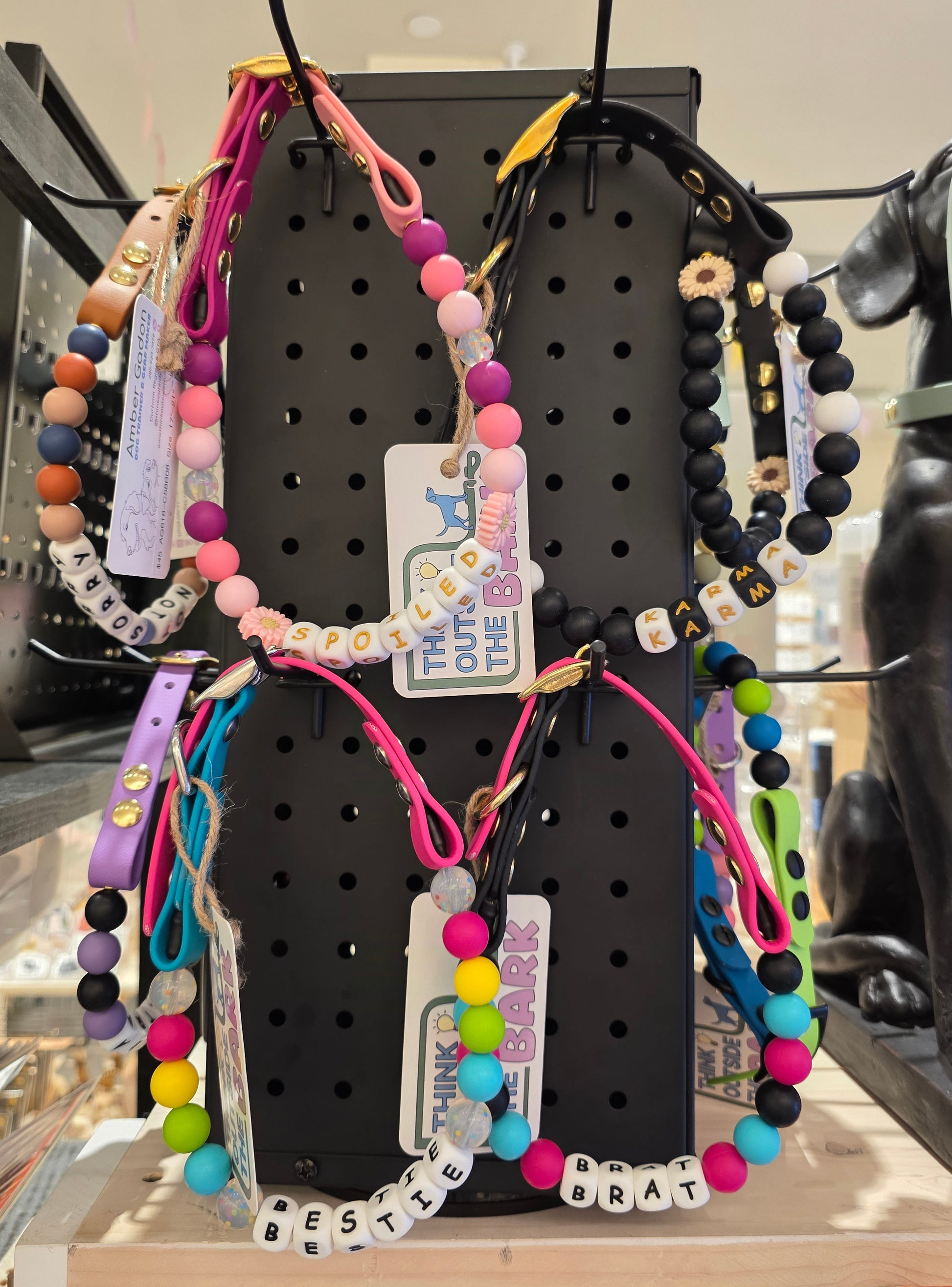 Handmade custom biothane dog collar with colorful silicone beads and personalized name letters.